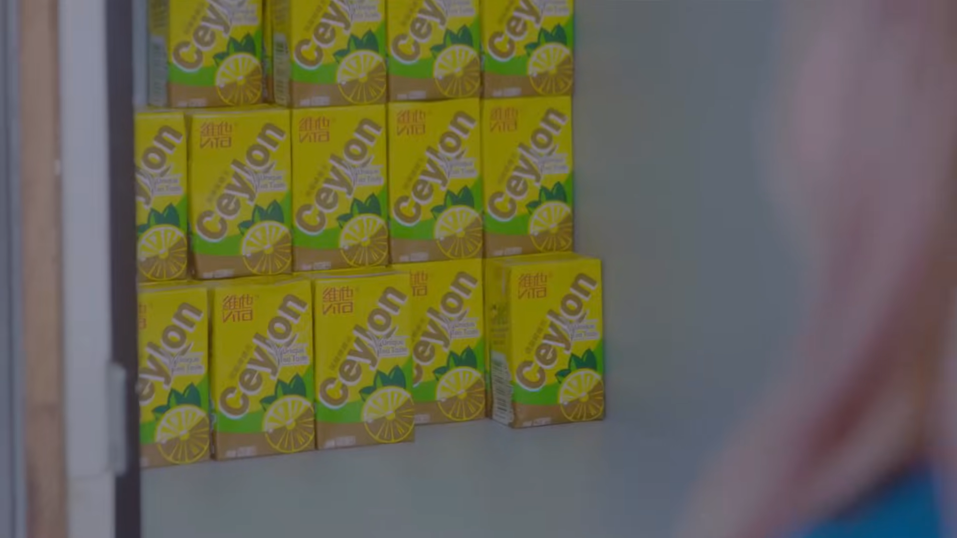 Several identical juice boxes inside the locker.